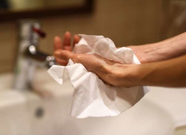 drying hands with paper towel